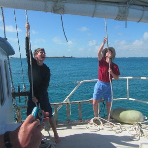 Spannker Crew hoisting the throat and peak halyards