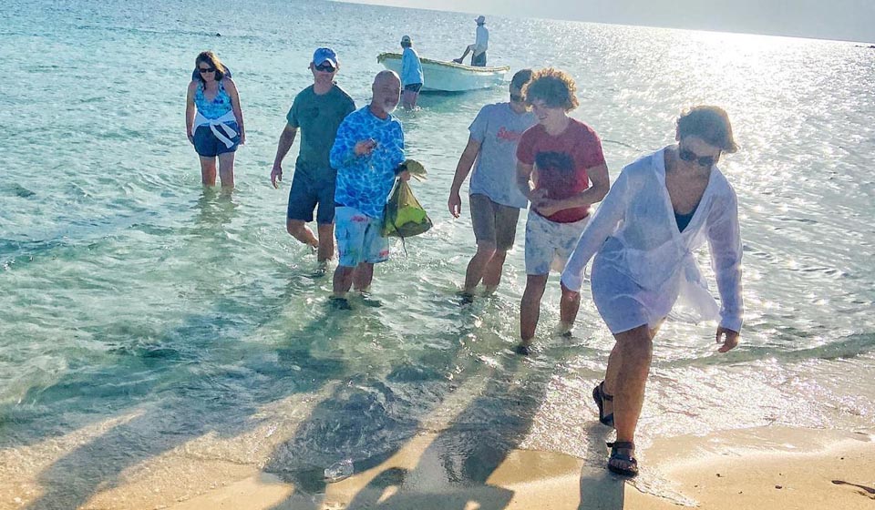 Ciganka charter guests wading ashore